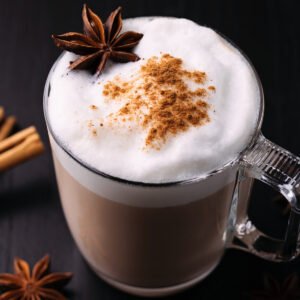 High angle view of chai tea latte on black surface