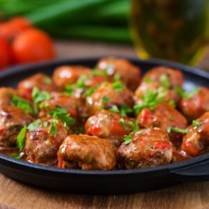 Meatballs in sweet and sour tomato sauce